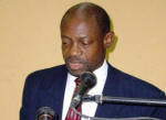 Photo # 1 - St. Kitts and Nevis Prime Minister and Chairman of PANCAP, Hon. Dr. Denzil L. Douglas addressing the delegates to the 10th Meeting of the Regional Coordinating Mechanism of the PAN Caribbean Partnership against HIV and AIDS. Seated&nbsp; Left to right)&nbsp;Belize Minister of Health and Chair of the RCM, Hon. Pablo Marin; St. Kitts and Nevis Minister of Health, Hon. Rupert Herbert and Director of PANCAP Coordinating Unit, Mr. Carl Browne.